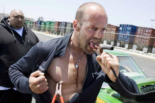 Jason Statham holds a Glock 17 as Arthur Bishop in The Mechanic 2011